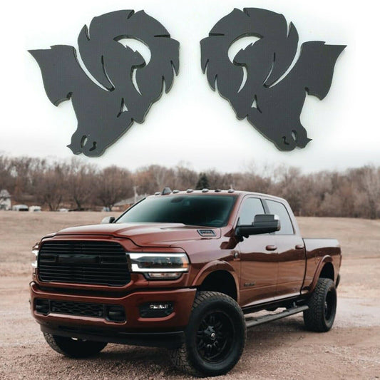 Custom Dodge Ram Hellcat Emblem in black shown above a lifted brown Dodge Ram truck in a rural setting